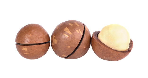 Three wooden basketballs with one that has a white ball on it.