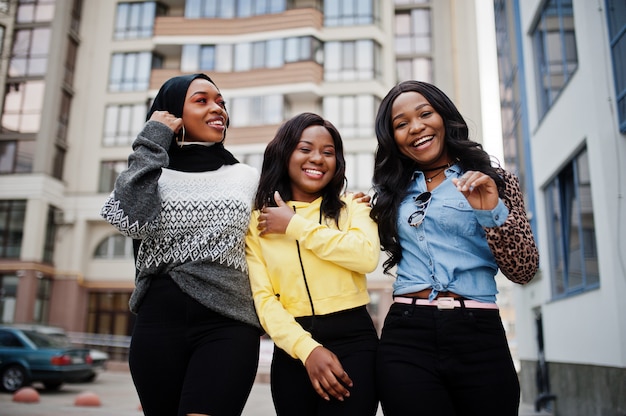 Photo three young college african american woman friends spend time together.