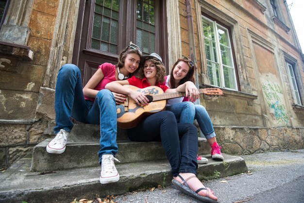 Three young girls with guitar