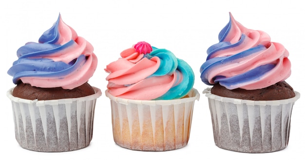 Three yummy cupcakes with icing  isolated on white 