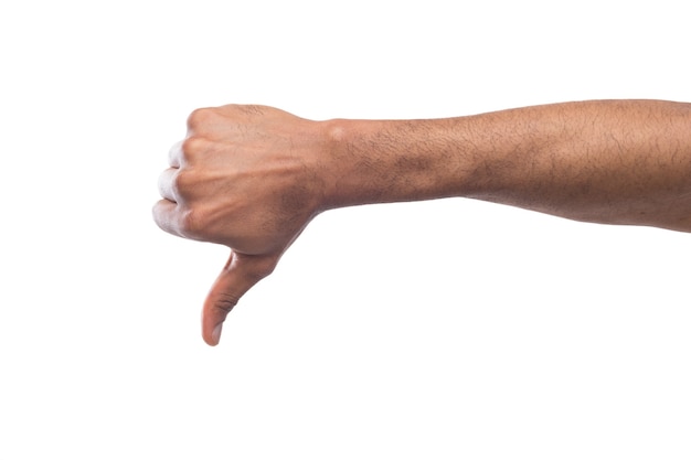 Thumb down of black man hand isolated on white background. Refusal and rejection concept