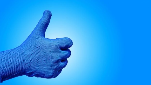 Большой палец руки вверх жест в перчатке, изолированных на синем фоне