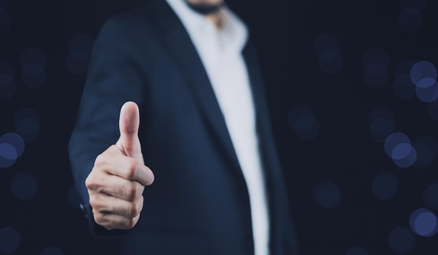 Thumbs up concept businessman showing thumbs up sign with copy space thumbs up