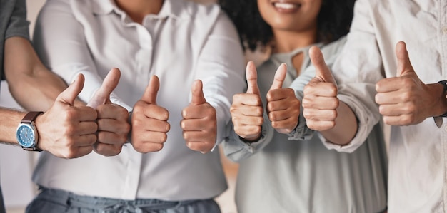 Thumbs up hands for teamwork motivation and support at advertising startup company office Partnership of marketing agency business people in collaboration trust and success of target goal meeting