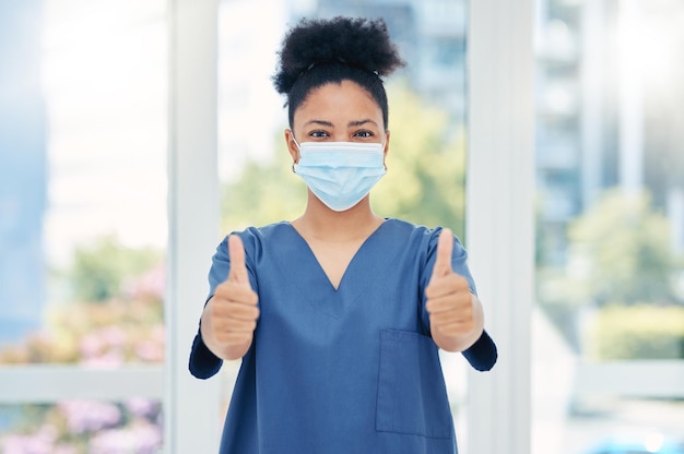 Thumbs up nurse doctor and surgeon in covid hospital clinic and surgery for healthcare success trust and support Portrait of medical worker with hand emoji for motivation agreement and good news