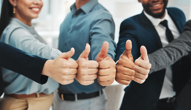 Photo thumbs up success and group closeup or people winning support or thank you hands or emoji yes like or winner with diversity employees for team building agreement vote or teamwork collaboration