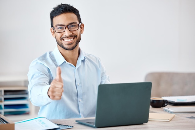 Thumbs up success and motivation from businessman with laptop for marketing and advertising research Portrait of happy corporate employee worker or business man with positive support hand gesture