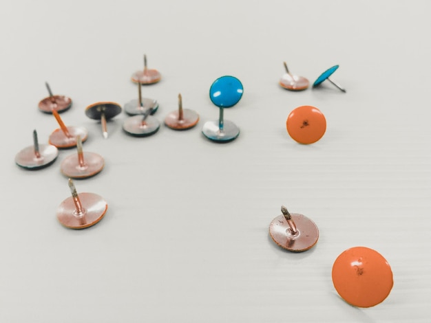 Photo thumbtacks on table