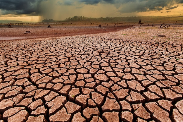 Thunder storm sky Rain clouds Cracked dry land without wate