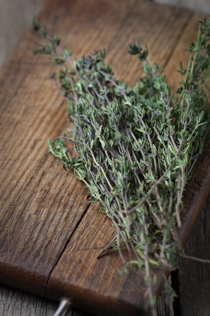 Thyme bunch on wooden board