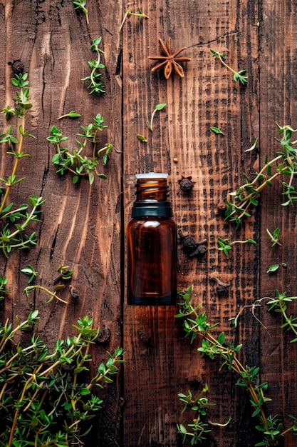 Photo thyme essential oil in a bottle selective focus