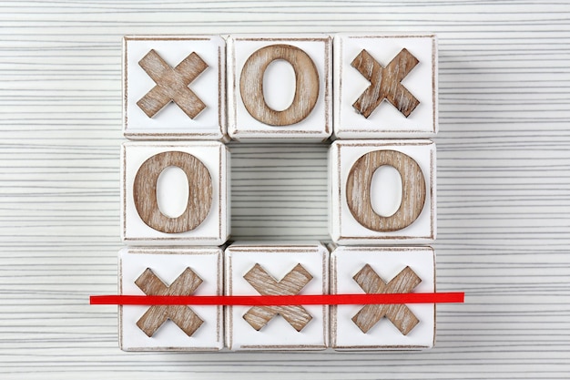 Foto tic tac toe op een houten achtergrond