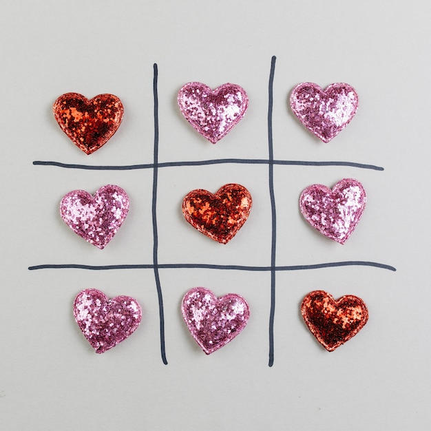 Photo tic-tac-toe with decorative sparkling hearts