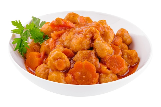 Tiftels in carrot sauce in a bowl