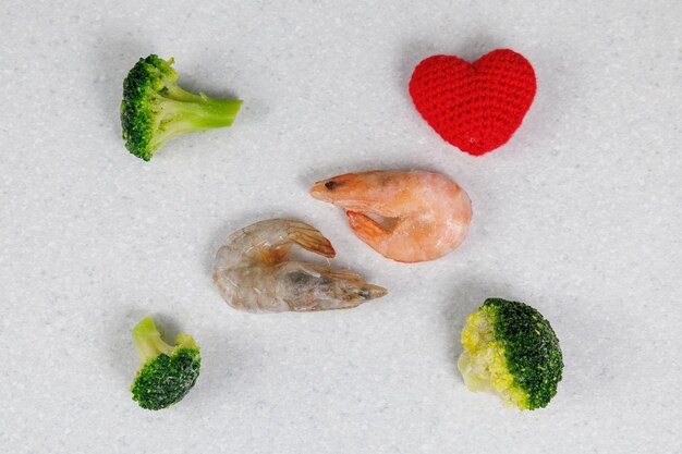 Tiger and king prawns lie on a light table Frozen products in ice glaze