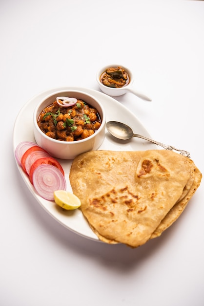 Tikona paratha of triangle parotha met chole of choley of chana masala