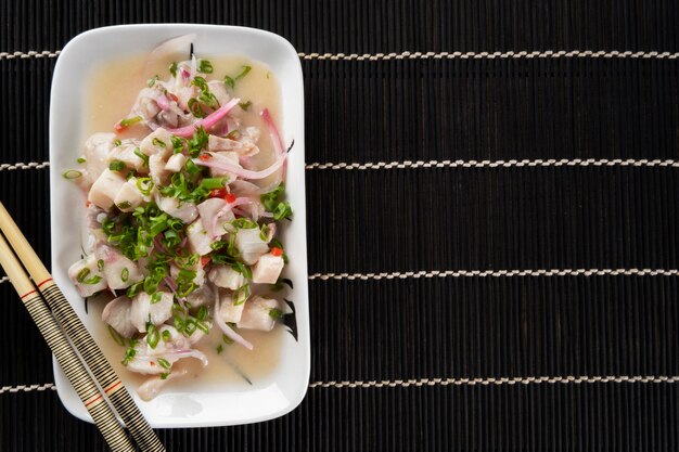 Photo tilapia ceviche with red onion.