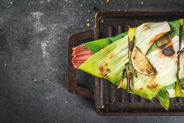 Tilapia roasted on grill in leeks