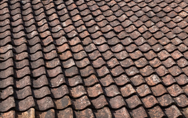 tile laid in a row on the roof of the house 