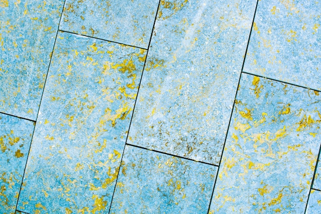 Tile, marble, concrete aged texture. old, vintage blue, Fortuna Gold background. gold with roughness and cracks.