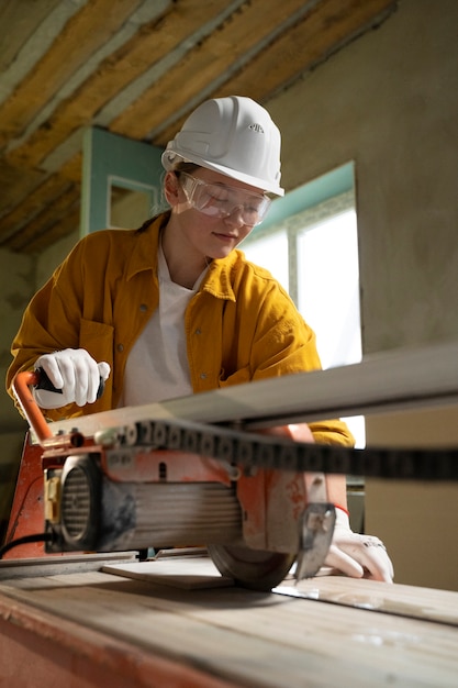 Tiler working on renovation of apartment