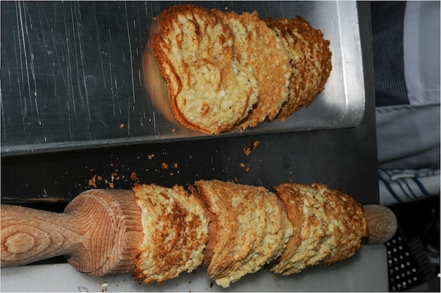 Tiles or crunchy almonds drying on kitchen utensils