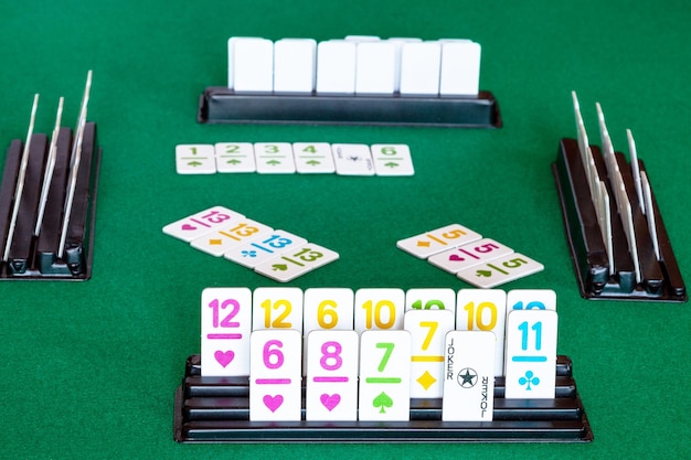 Photo tiles in rack and gameplay in rummy on table