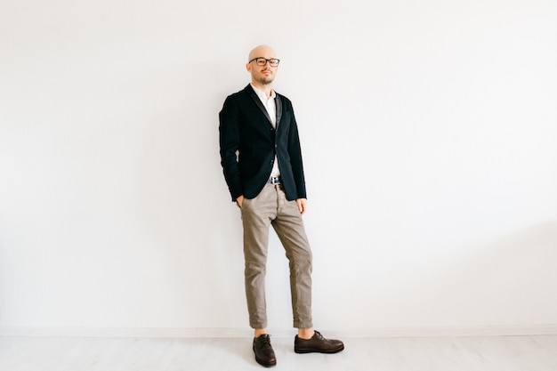 Tilt shift  soft portrait of businessman in expensive italian fashionable clothes standing indoors