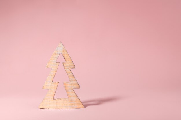 Timber wooden Christmas tree on pink