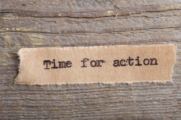 Time for action word on a piece of paper close up business creative motivation concept