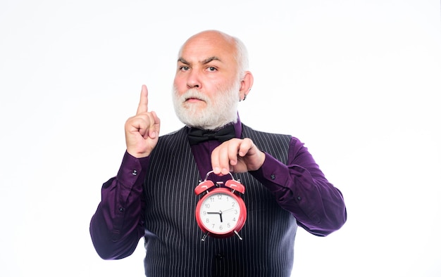 Time and age Timekeeping mature man with beard clock show time time management business startup retirement watchmaker or watch repairer mature bearded man with alarm clock inspiration