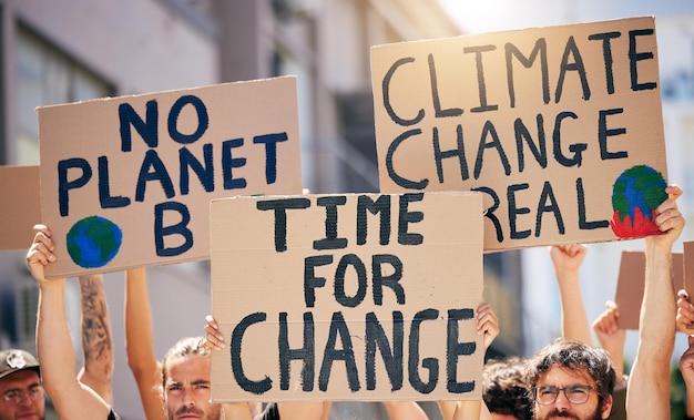 The time for change is now Shot of a group of people holding up signs at a protest rally