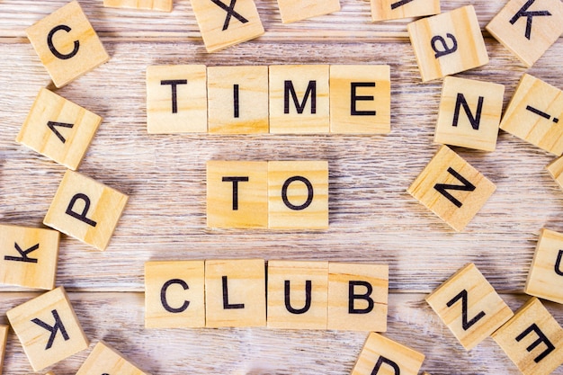 "Time To Club" text on wooden cubes