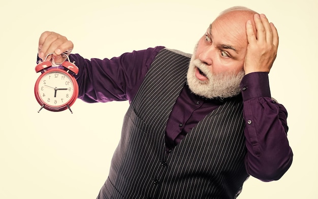 Time does not spare anyone Time and age concept Bearded man clock ticking Aged man holding alarm clock Senior man white beard Senior timekeeper Counting time Lifetime ageing and getting older