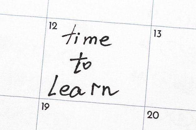 "time to learn" sign written with a marker on the calendar.