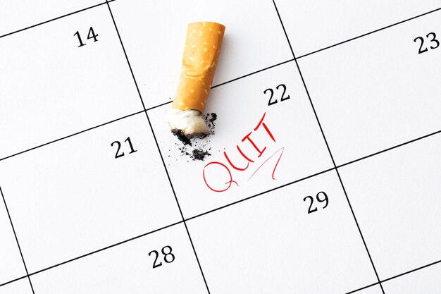 Photo time to quit smoking cigarette butts on the calendar