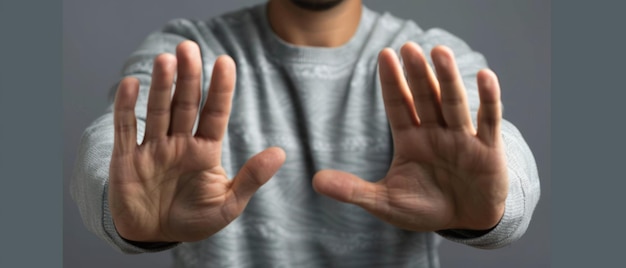 Photo time stands still an enigmatic gesture on a gray background