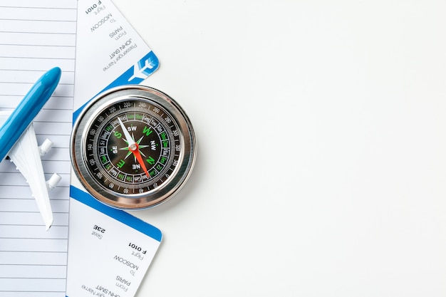 Time to Travel. Idea for tourism with flight tickets and compass on white background