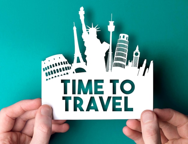 Time to travel paper cut out shape with famous city travel destination landmarks