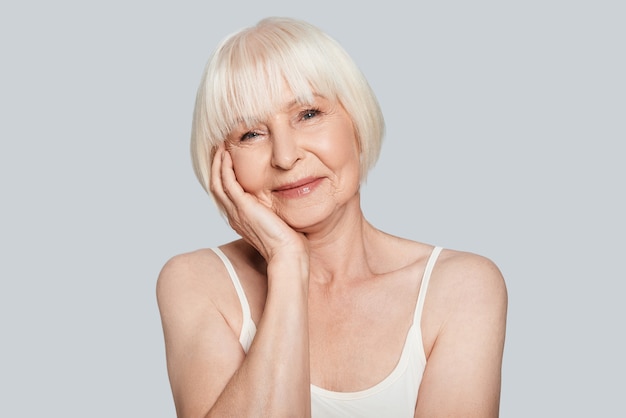 Time for yourself. Beautiful senior woman looking at camera and smiling 