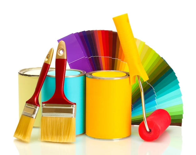 Tin cans with paint roller brushes and bright palette of colors isolated on white