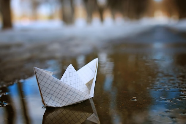 Tinted photo paper boat on spring street