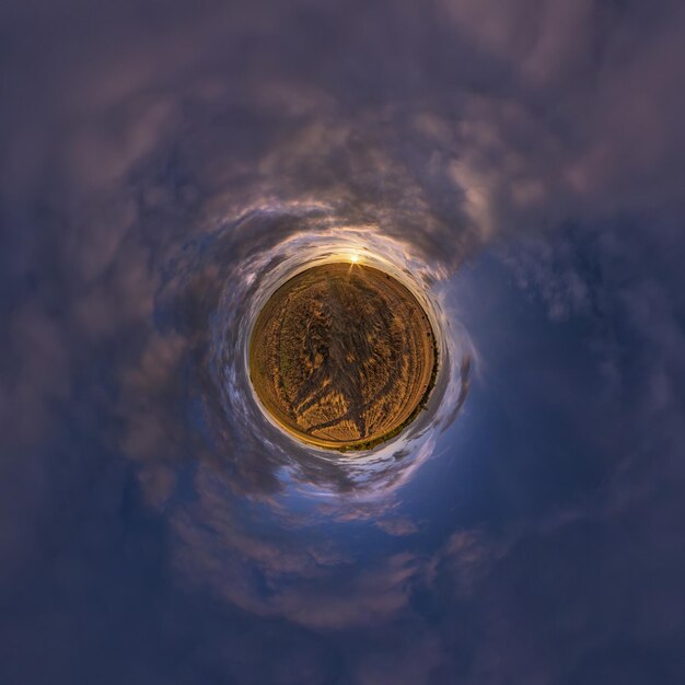 Tiny planet in blue sky with beautiful clouds Transformation of spherical panorama 360 degrees Spherical abstract aerial view Curvature of space