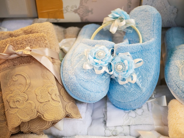 Tiny slippers and towels for newborn child