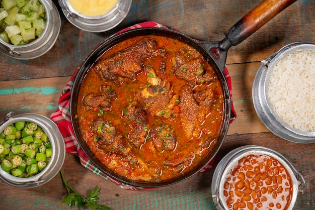 tipical brazilian recipe with farm chicken gravy rice and okra galinha caipira top view