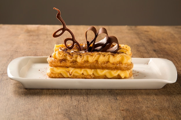 Tiramisu - Classical Dessert with Cinnamon and Coffee. Garnished with chocolate