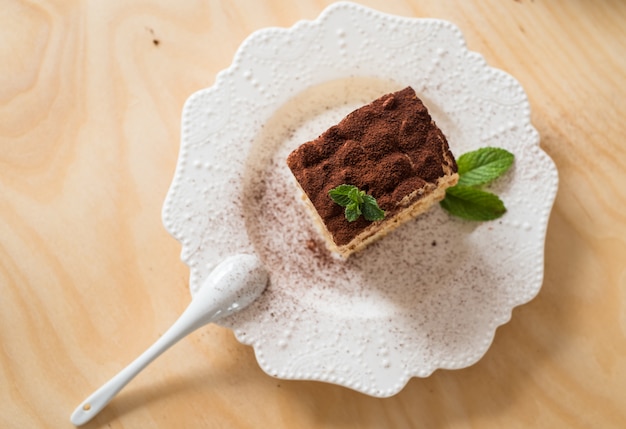 Tiramisu coffee cake served on a white plate