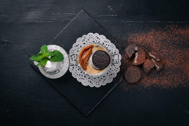 Tiramisu Dessert of cookies and mascarpone cheese On a wooden surface Top view Free space for your text