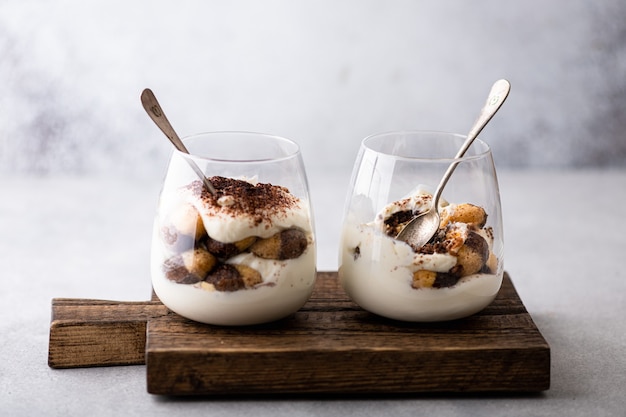 Tiramisu dessert in a glasses on the table