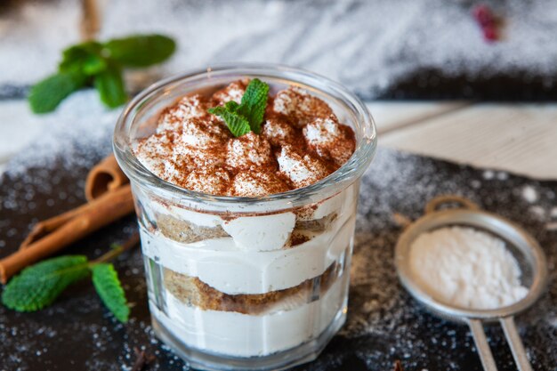 Tiramisu dessert with mascarpone cream and cocoa